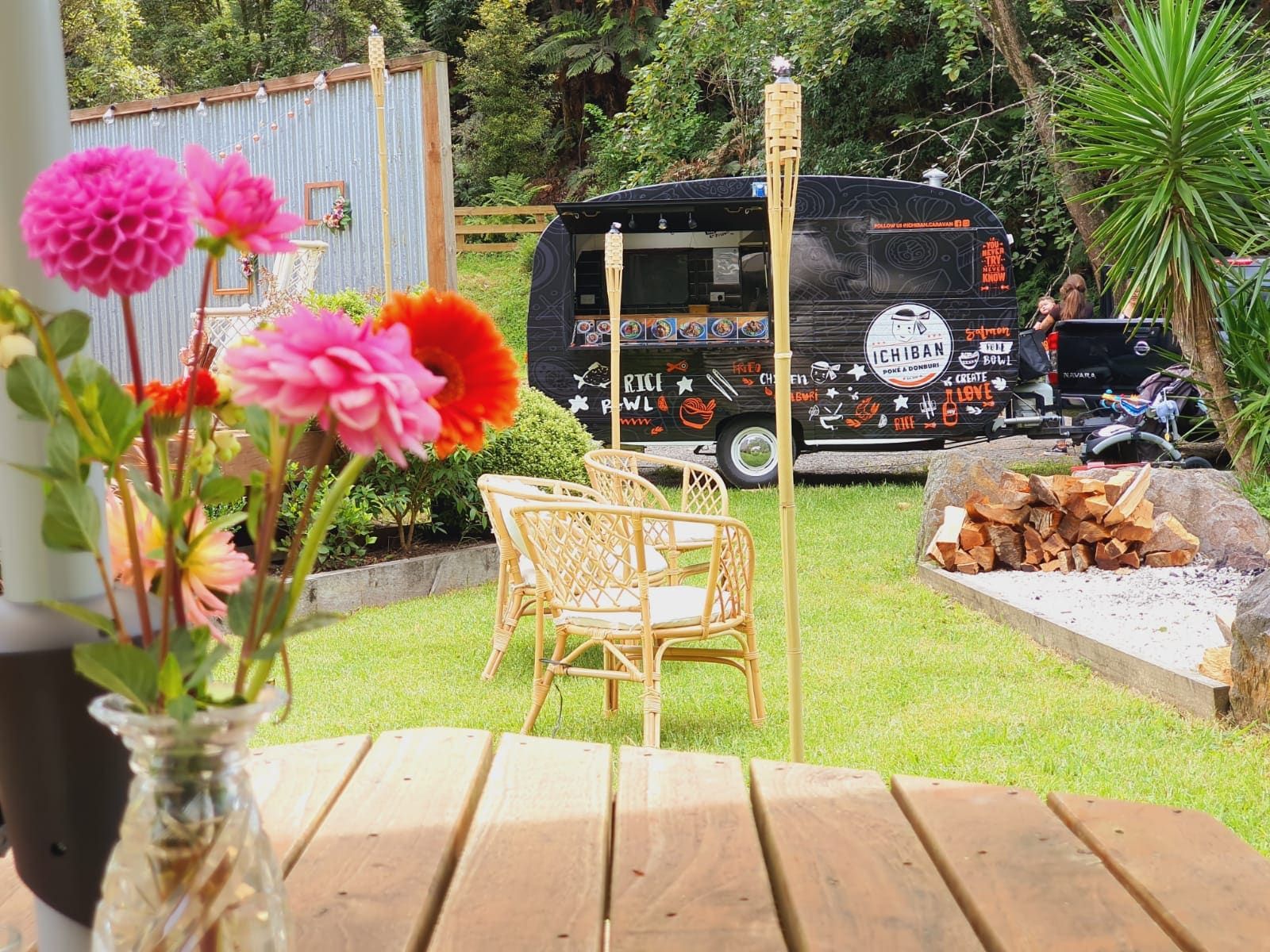 The Ichiban caravan parked at a garden wedding reception